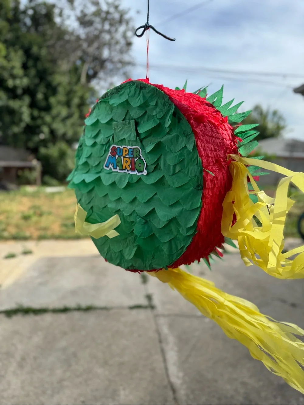 Super Mario Red & Green Party Piñata with Yellow Streamers